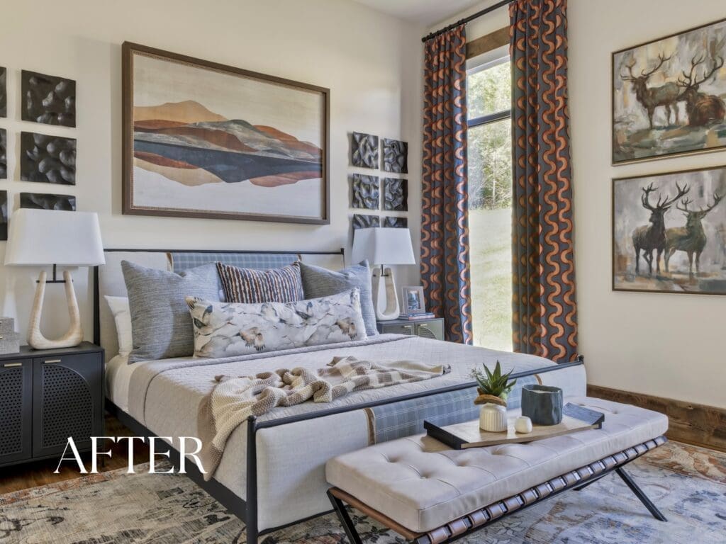 Luxury Ozark mountain retreat bedroom designed by Baker Design Group, featuring a custom upholstered bed, patterned drapery, and nature-inspired landscape artwork.